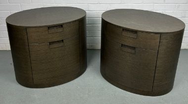 A PAIR OF BROWN OVAL WOODEN BEDSIDE CABINETS BY MAXALTO, Each with two sliding compression