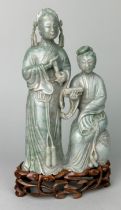 A FINE PAIR OF JADEITE MALE AND FEMALE FIGURES 19TH CENTURY, The figures 20cm x 11cm. Mounted on a