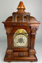 AN EDWARDIAN WALNUT CHIMING MANTEL CLOCK, 30cm w x 18cm d x 49cm h With architectural case, gilt