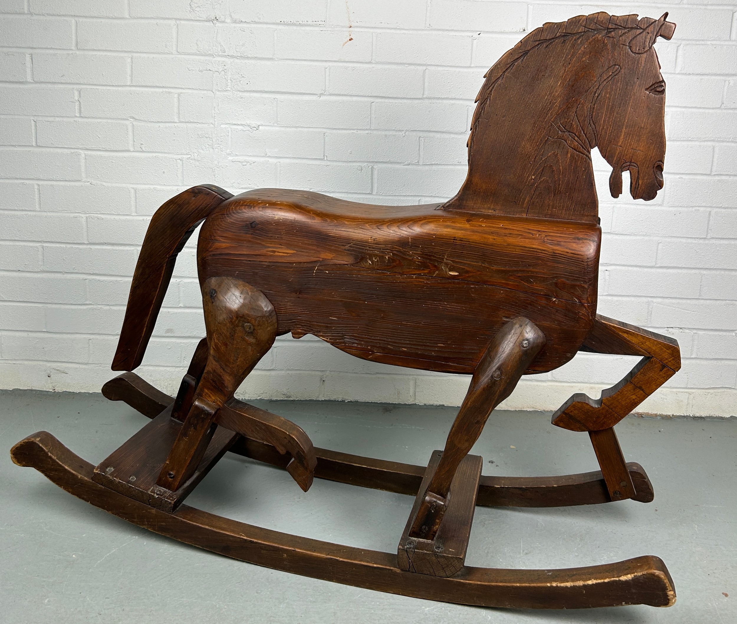 A 19TH CENTURY ROCKING HORSE FROM NUREMBERG IN GERMANY, Primitively carved, the horse having bent - Image 9 of 9