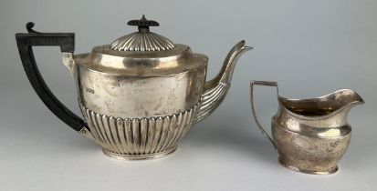 A VICTORIAN SILVER TEA POT AND MILK JUG, Total weight 840gms