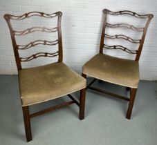 A PAIR OF EARLY 19TH CENTURY CHIPPENDALE DESIGN LADDER BACK SIDE CHAIRS, Upholstered in neutral