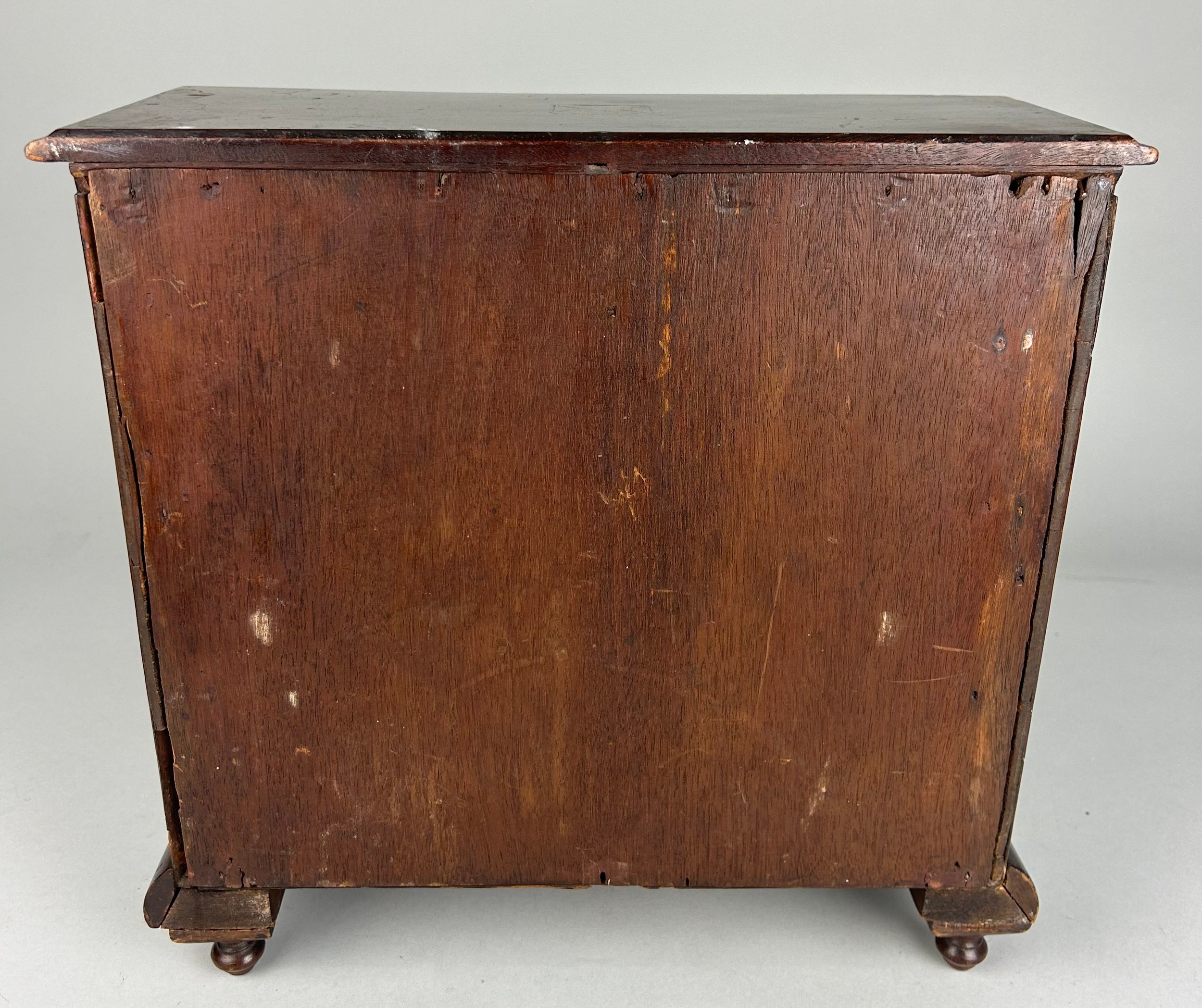 AN EARLY 19TH CENTURY APPRENTICE CHEST OF DRAWERS, With parquetry inlay raised on turned feet. - Image 4 of 5