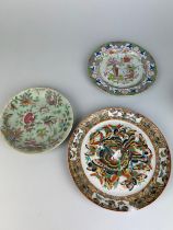 AN EARLY 19TH CENTURY CHINESE PLATE AND TWO OTHERS, Largest 24cm x 24cm