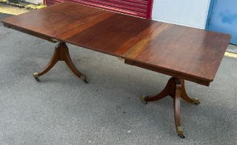 AN EARLY 19TH CENTURY EXTENDABLE DINING TABLE, Possibly a marriage with the legs being earlier