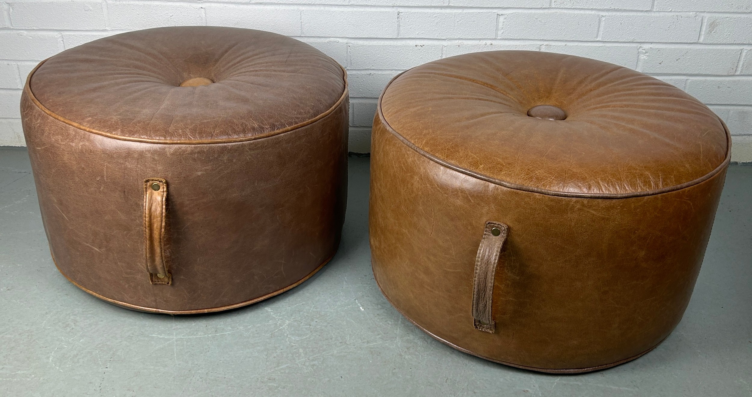 A PAIR OF HEALS CIRCULAR STOOLS OR POUFFES UPHOLSTERED IN TAN LEATHER, 60cm x 35cm each. - Image 2 of 3