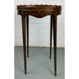 AN ELEGANT OVAL SIDE TABLE ON FOUR TAPERING LEGS WITH BRUSH AND SLIDE DRAWER 63cm x 36cm x 25cm