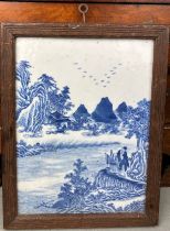 A CHINESE 19TH CENTURY BLUE AND WHITE PAINTED PORCELAIN PANEL DEPICTING FU LU SHOU BESIDE A RIVER