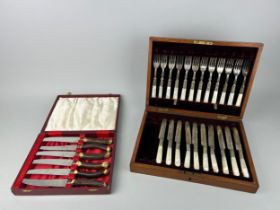 A SILVER PLATED AND MOTHER OF PEARL CUTLERY SET CONSISTING OF TWELVE FORKS AND TEN KNIVES