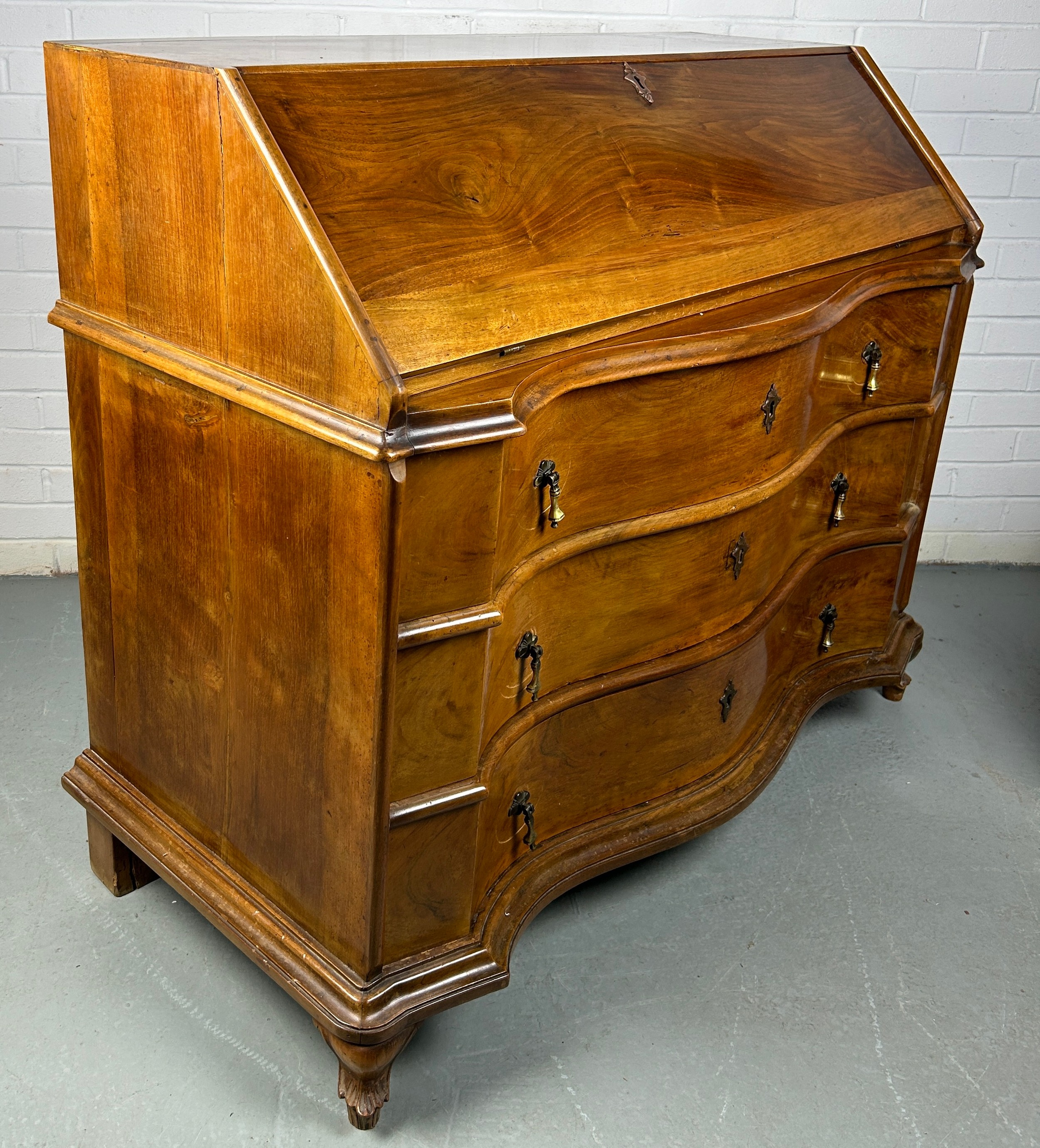 A CONTINENTAL WALNUT SERPENTINE BUREAU, 116cm x 108cm x 58cm Early 20th century, with fall front - Image 10 of 13