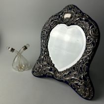 A SILVER FRAMED MIRROR AND AN UNUSUAL GLASS SCENT BOTTLE WITH SILVER MOUNTS (2)