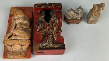 A CHINESE RED LACQUER AND GILT PANEL WITH TWO FIGURES, Along with another similar, a soapstone