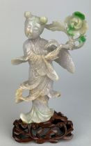 A JADEITE FIGURE OF A GIRL HOLDING A FLOWER, 13cm x 8cm Mounted on a later rosewood stand.