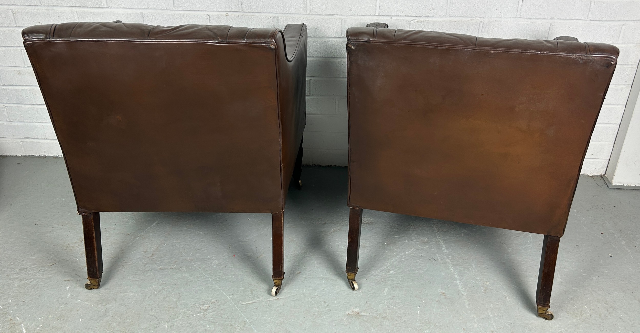 A PAIR OF BROWN LEATHER BUTTON BACK CLUB CHAIRS, Removed from Brown's Club London. Each raised on - Image 4 of 5