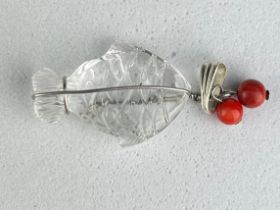 A CARVED ROCK CRYSTAL FISH PENDANT WITH TWO CORALS