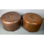 A PAIR OF HEALS CIRCULAR STOOLS OR POUFFES UPHOLSTERED IN TAN LEATHER, 60cm x 35cm each.