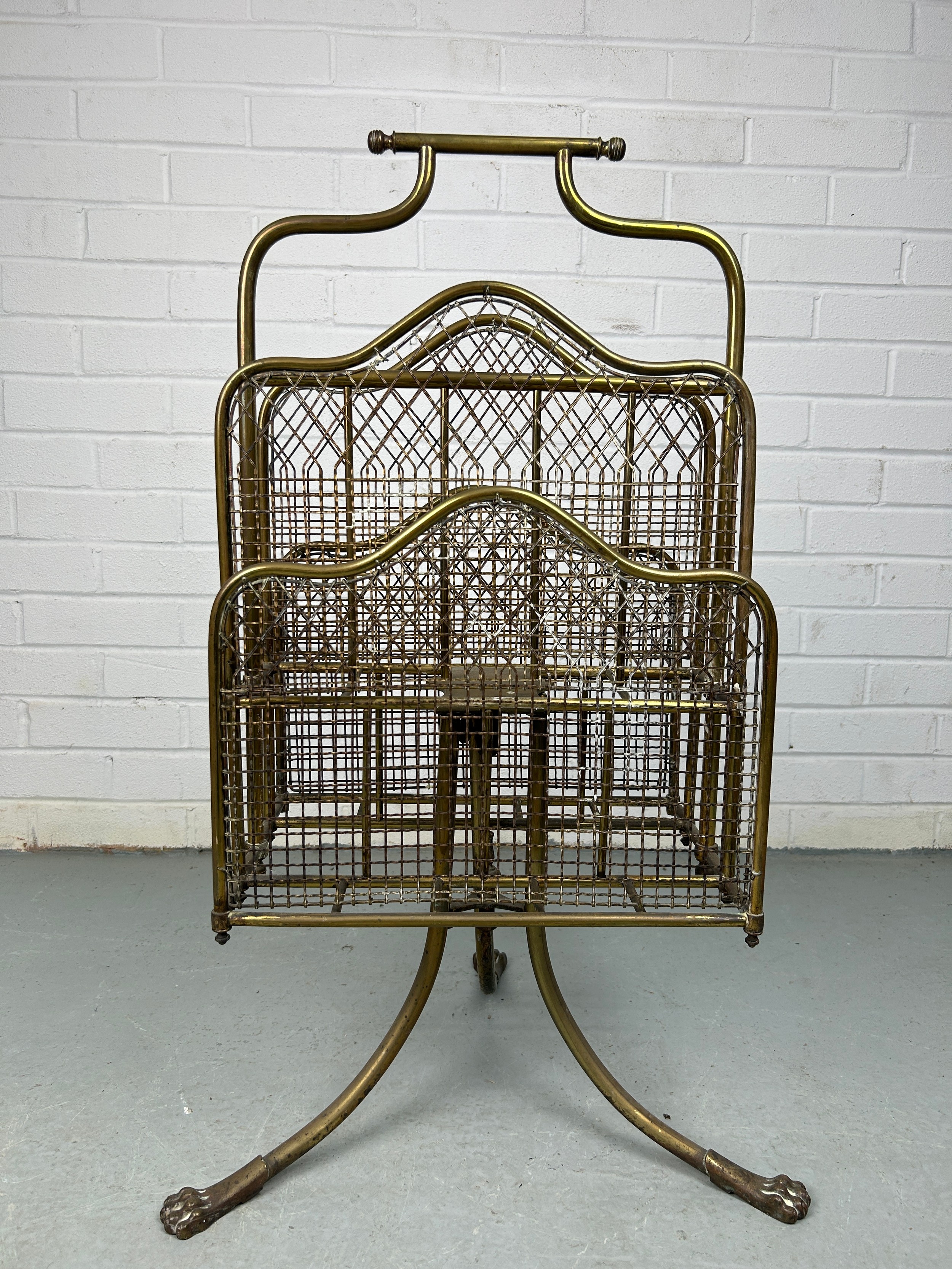 AN EARLY 20TH CENTURY REVOLVING BRASS MAGAZINE RACK WITH LION PAW FEET, 80cm x 40cm x 26cm - Image 2 of 4