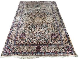 A LARGE AND FINE PERSIAN CARPET DECORATED WITH FLORAL MOTIFS, 355cm x 255cm