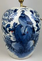 A CHINESE BLUE AND WHITE VASE MOUNTED AS A LAMP REPUBLIC PERIOD, Decorated with flowers and birds.