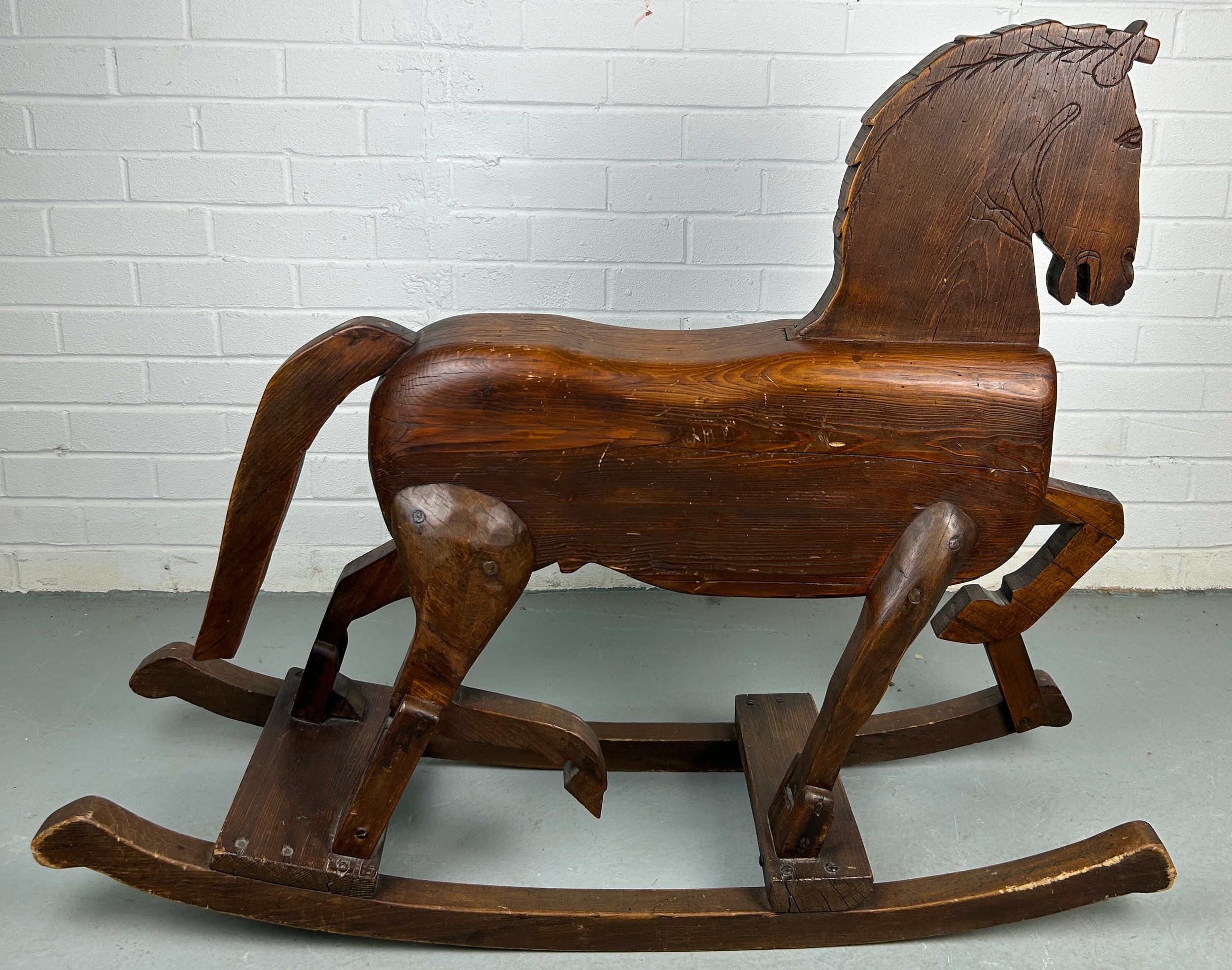 A 19TH CENTURY ROCKING HORSE FROM NUREMBERG IN GERMANY, Primitively carved, the horse having bent - Image 8 of 9