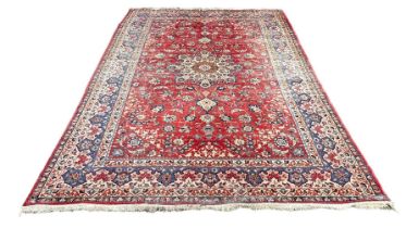 A LARGE PERSIAN CARPET, 395cm x 260cm Some wear.