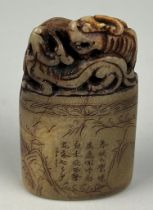 A 19TH CENTURY CHINESE SOAPSTONME SEAL WITH A LION AND CALLIGRAPHY, 7.5cm x 4.5cm x 2.3cm