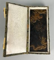 A CHINESE SCHOLARS STONE DECORATED WITH A GOLDEN FIVE CLAWED DRAGON CHASING THE FLAMING PEARL, In