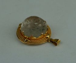 A KABALLAH ENGRAVED ROCK CRYSTAL SET IN 14CT GOLD PENDANT, Weight: 6.7gms Stone 19mm D