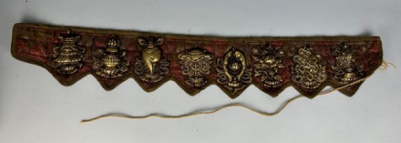 A TIBETAN BELT WITH BRASS SYMBOLS, 71cm x 12cm