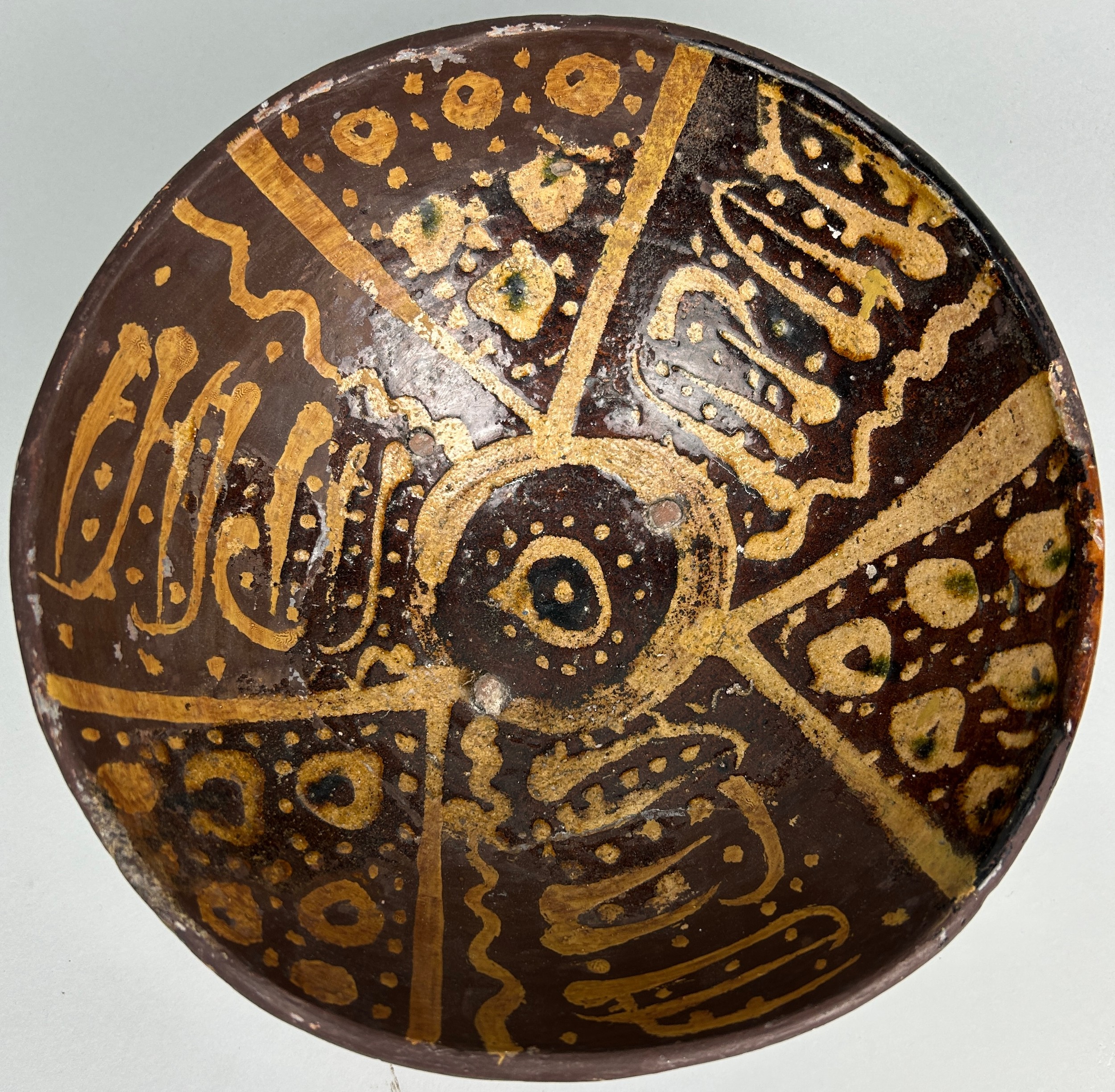 A 14TH CENTURY MAMLUK SLIPWARE POTTERY FOOTED BOWL, 24cm x 13cm Provenance: Purchased by the current - Image 8 of 8