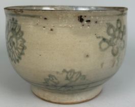 A SOUTHEAST ASIAN BOWL DECORATED WITH FLOWERS, Possibly 17th century or earlier. 17cm x 12cm