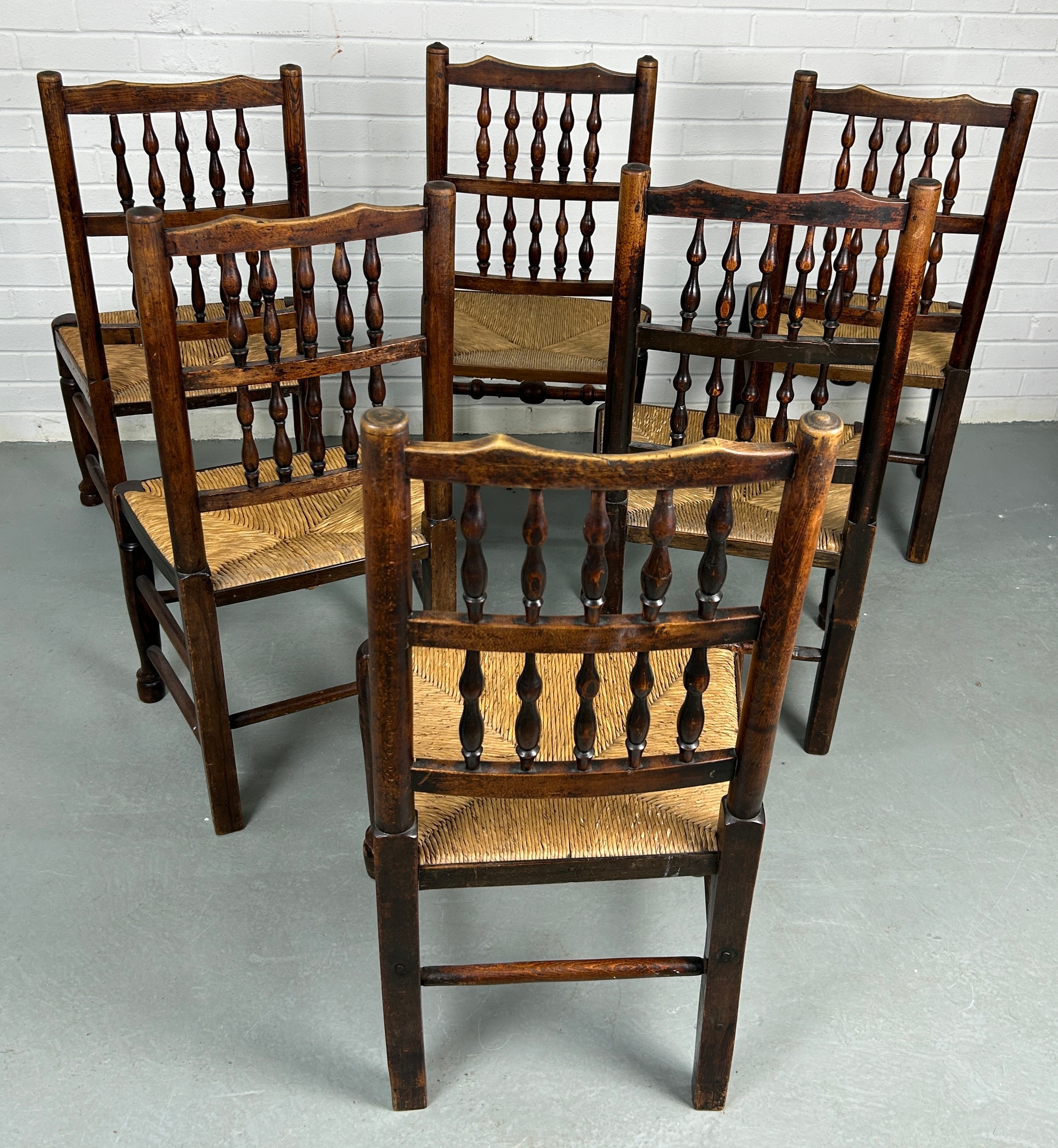 A SET OF EIGHT COUNTRY HOUSE BOBBIN SPINDLE BACK CHAIRS WITH RUSH SEATS PROBABLY NORTH COUNTRY, Late - Image 5 of 8