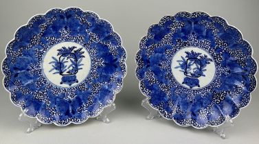 A PAIR OF JAPANESE BLUE AND WHITE LOBED DISHES (2), 30cm diameter each.
