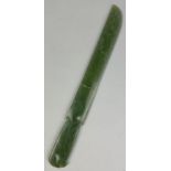 A CHINESE JADE RITUAL DAGGER BLADE (GE), Broken into two (clean break). 34cm L