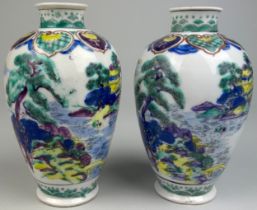 A PAIR OF CHINESE VASES DECORATED WITH FIGURES AND LANDSCAPE SCENES, 18cm x 9cm each.