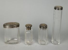 FOUR GLASS BOTTLES WITH SILVER TOPS (4)