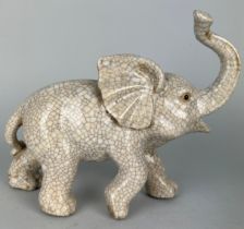 A CHINESE CRACKLE GLAZED ELEPHANT, 24cm x 20cm