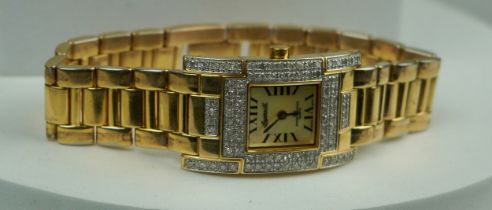 A GOLD PLATED ANGERSOLL WATCH SET WITH TINY DIAMONDS