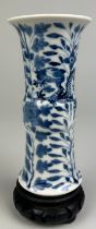 A CHINESE BLUE AND WHITE VASE OF GU FORM, Depicting a four clawed dragon amongst foliage. 15cm H