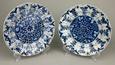 A PAIR OF 18TH CENTURY KANGXI PERIOD BLUE AND WHITE DISHES, Old repairs. 20.5cm D