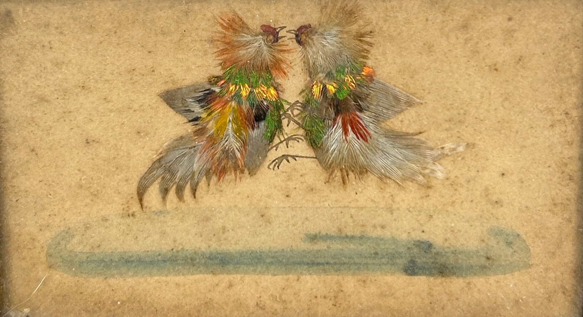 COCKFIGHTING INTEREST: A FRAMED SET OF THREE WATERCOLOURS WITH APPLIED BIRD FEATHERS DEPICTING A - Image 3 of 4