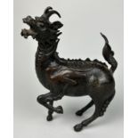 A CHINESE BRONZE FIGURE OF A MYTHICAL ANIMAL, POSSIBLY 18TH CENTURY, 18cm x 14cm With opening