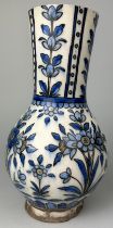 AN IZNIK DESIGN VASE POSSIBLY EARLY 19TH CENTURY DECORATED WITH FLOWERS, 28cm x 14cm