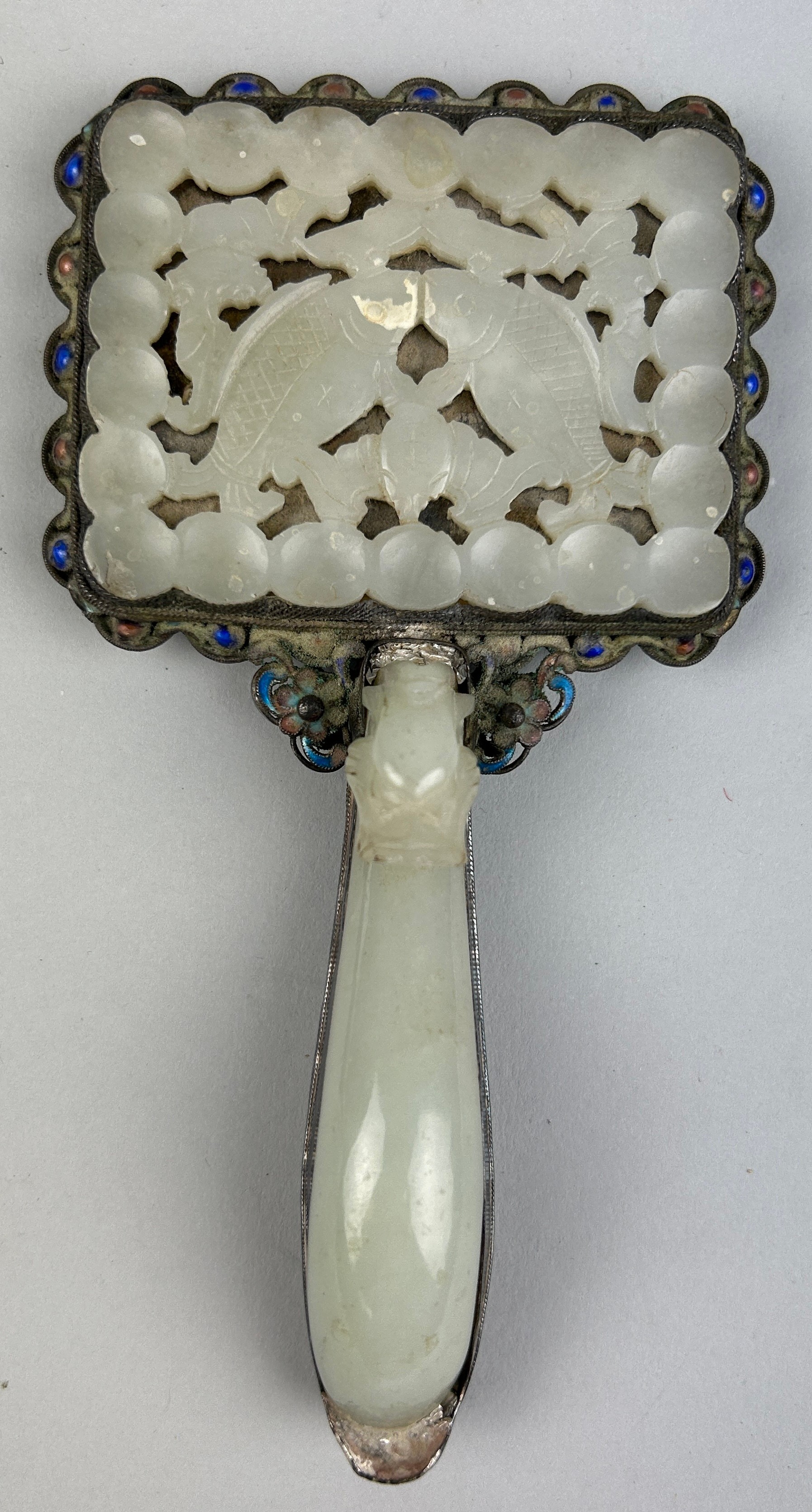 AN 18TH CENTURY CHINESE 'TWIN FISH' JADE PLAQUE SET IN AN ENAMELLED SILVER MIRROR WITH JADE HANDLE