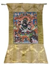 A 19TH CENTURY TIBETAN PAINTED SILK SCROLL WALL HANGING, 46cm x 34cm With silk border 86cm x 60cm