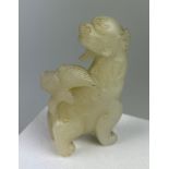 AN EARLY 19TH CENTURY CHINESE WHITE JADE GROUP OF A LION, 7.5cm x 4.7cm x 1.8cm