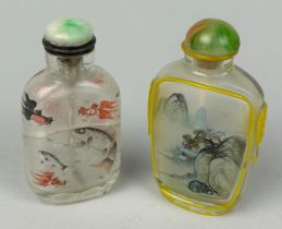TWO GLASS SNUFF BOTTLES DECORATED WITH FISH AND LANDSCAPE SCENES, Each 7cm H