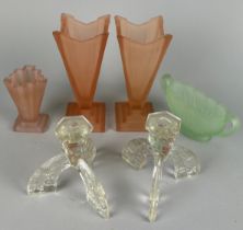 A COLLECTION OF GLASS PEDESTAL VASES, Green and pink along with a four armed crystal candelabra.