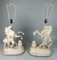 EQUESTRIAN INTEREST: A PAIR OF WHITE PAINTED METAL LAMPS IN THE FORM OF A REARING HORSE AND