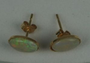 A PAIR OF OPAL EARRINGS SET IN 9CT GOLD, Total weight: 0.72gms 10mm x 0.6mm each.
